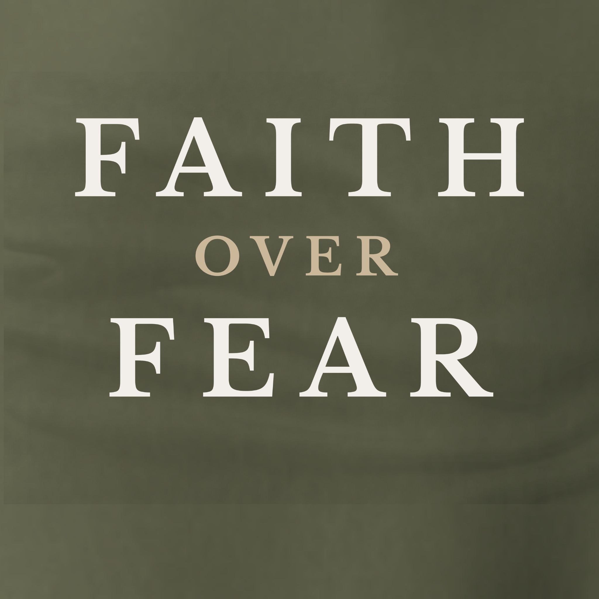 Dark green t-shirt with 'FAITH OVER FEAR' text in white and beige.