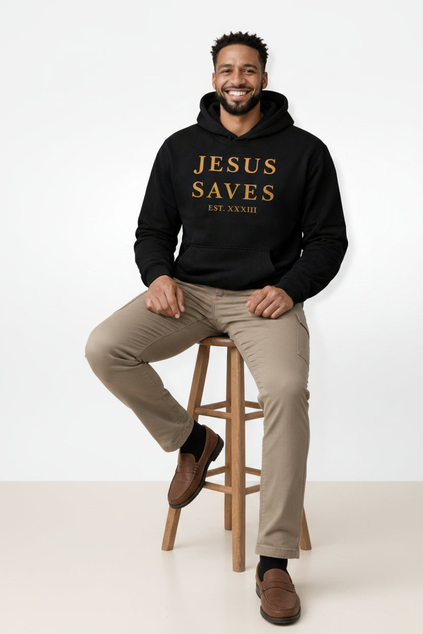 Man wearing a black hoodie with 'JESUS SAVES' text on a white background