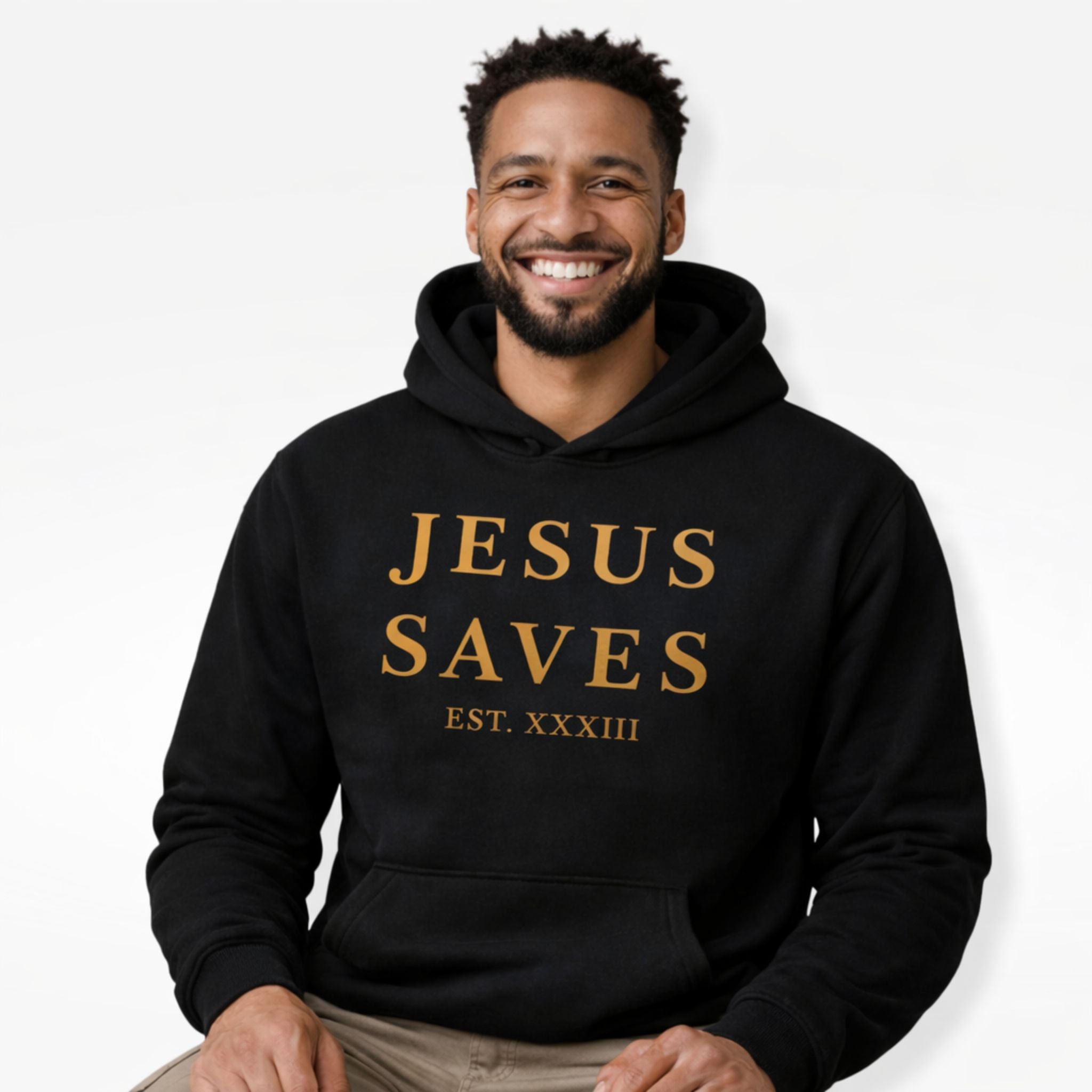 Man wearing a black hoodie with 'JESUS SAVES' text on a white background