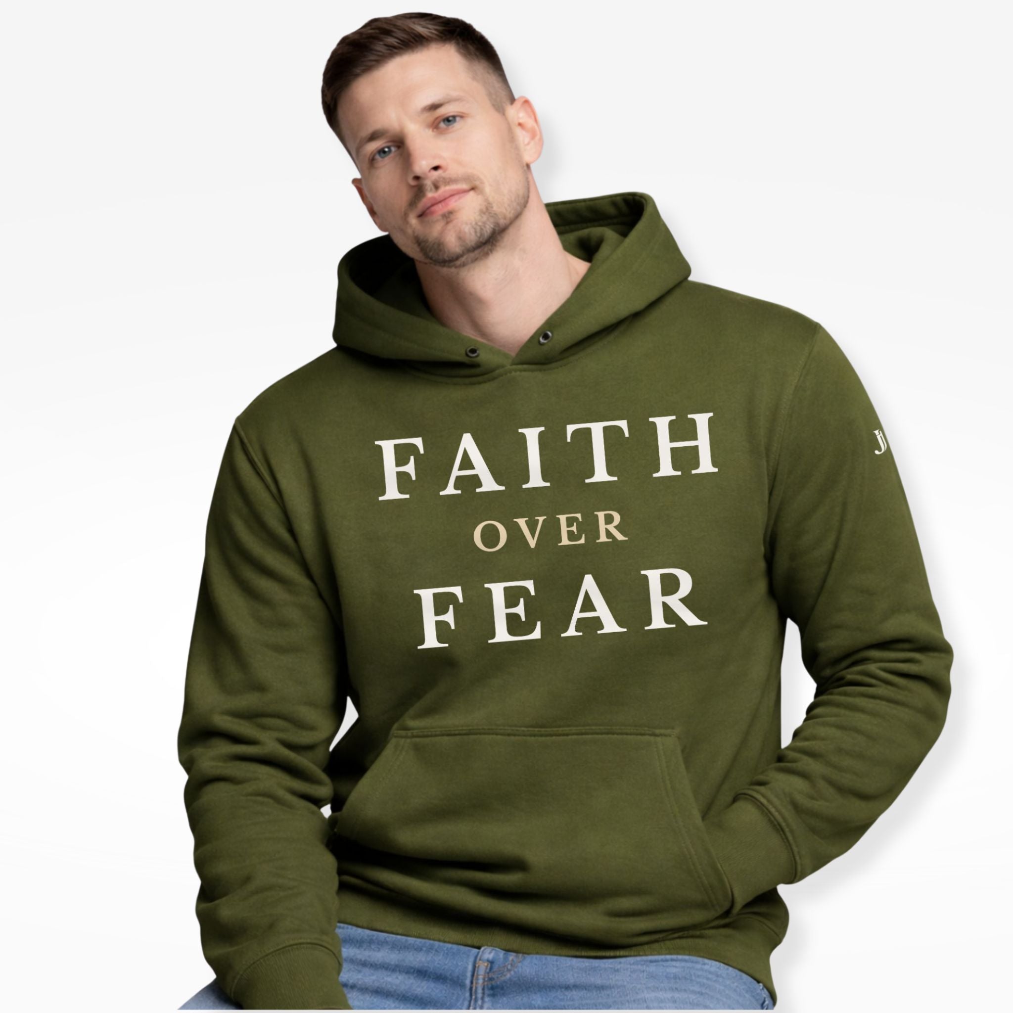 Man wearing a green hoodie with 'Faith Over Fear' text on a white background