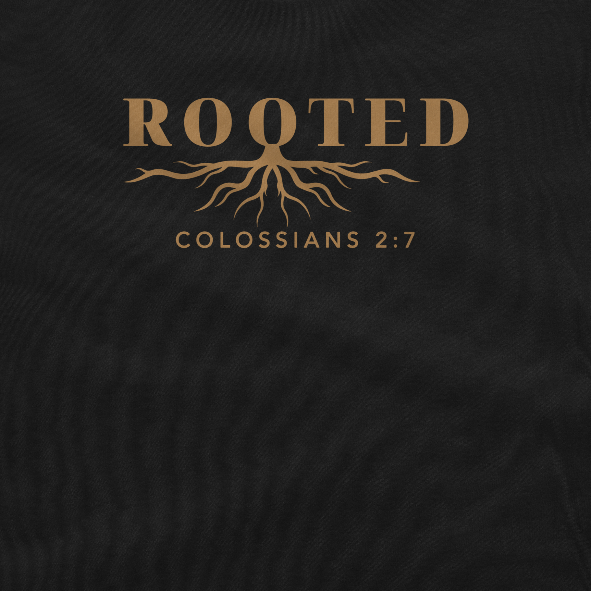 A close-up of a black garment, likely a t-shirt, featuring a gold graphic print with the word 'ROOTED' above a tree root design and the text 'COLOSSIANS 2:7'.