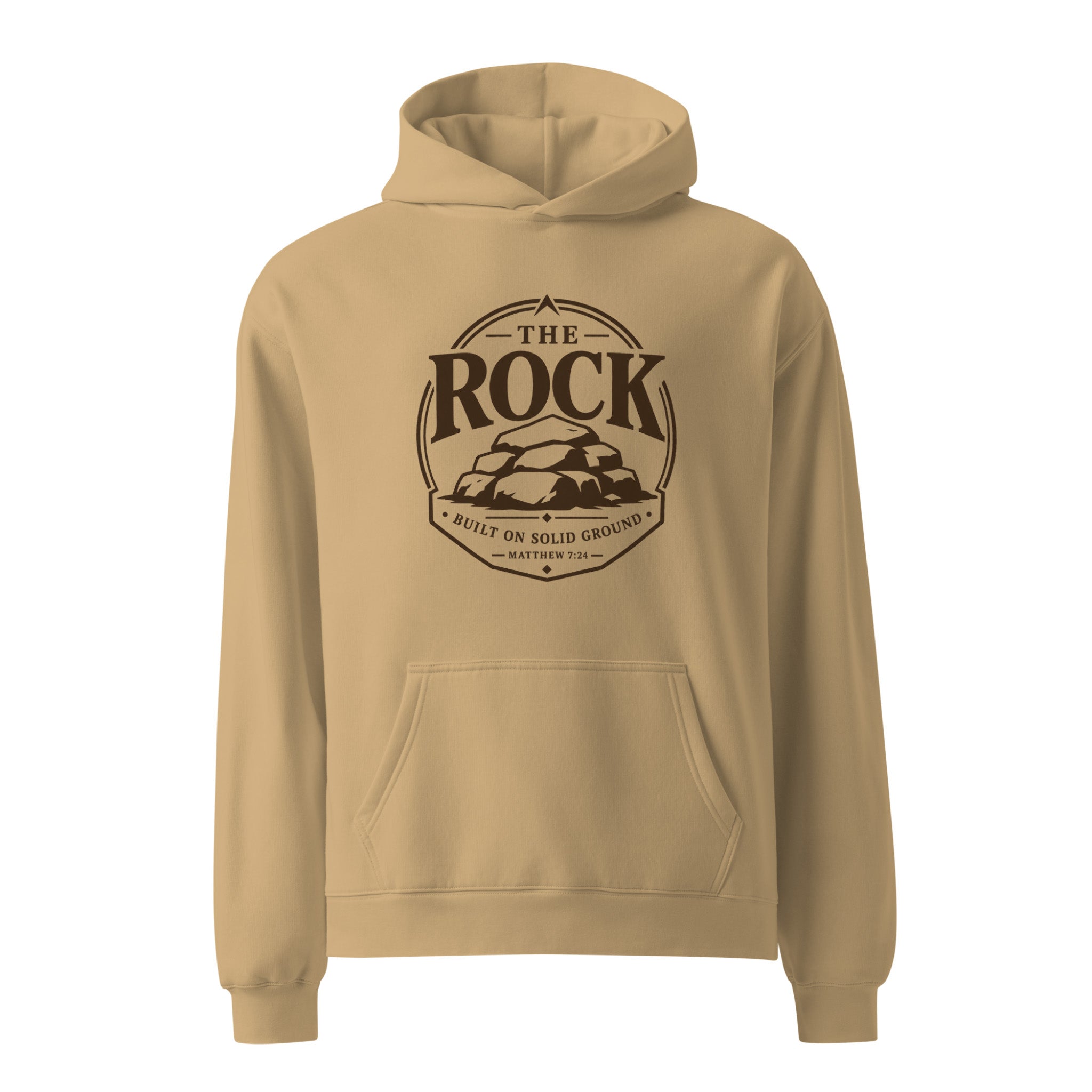 A tan pullover hoodie with a dark brown circular graphic on the chest reading 'THE ROCK BUILT ON SOLID GROUND MATTHEW 4:20' with an illustration of stacked rocks, shown on a plain white background.