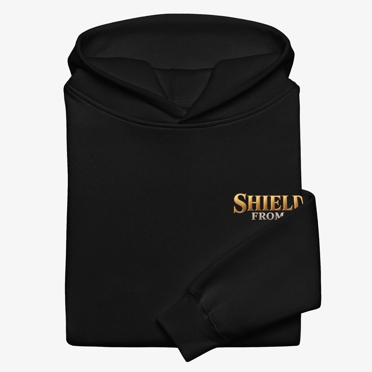 A folded black hoodie with a gold and white embroidered graphic reading 'SHIELD FROM' on the chest, shown on a plain white background.