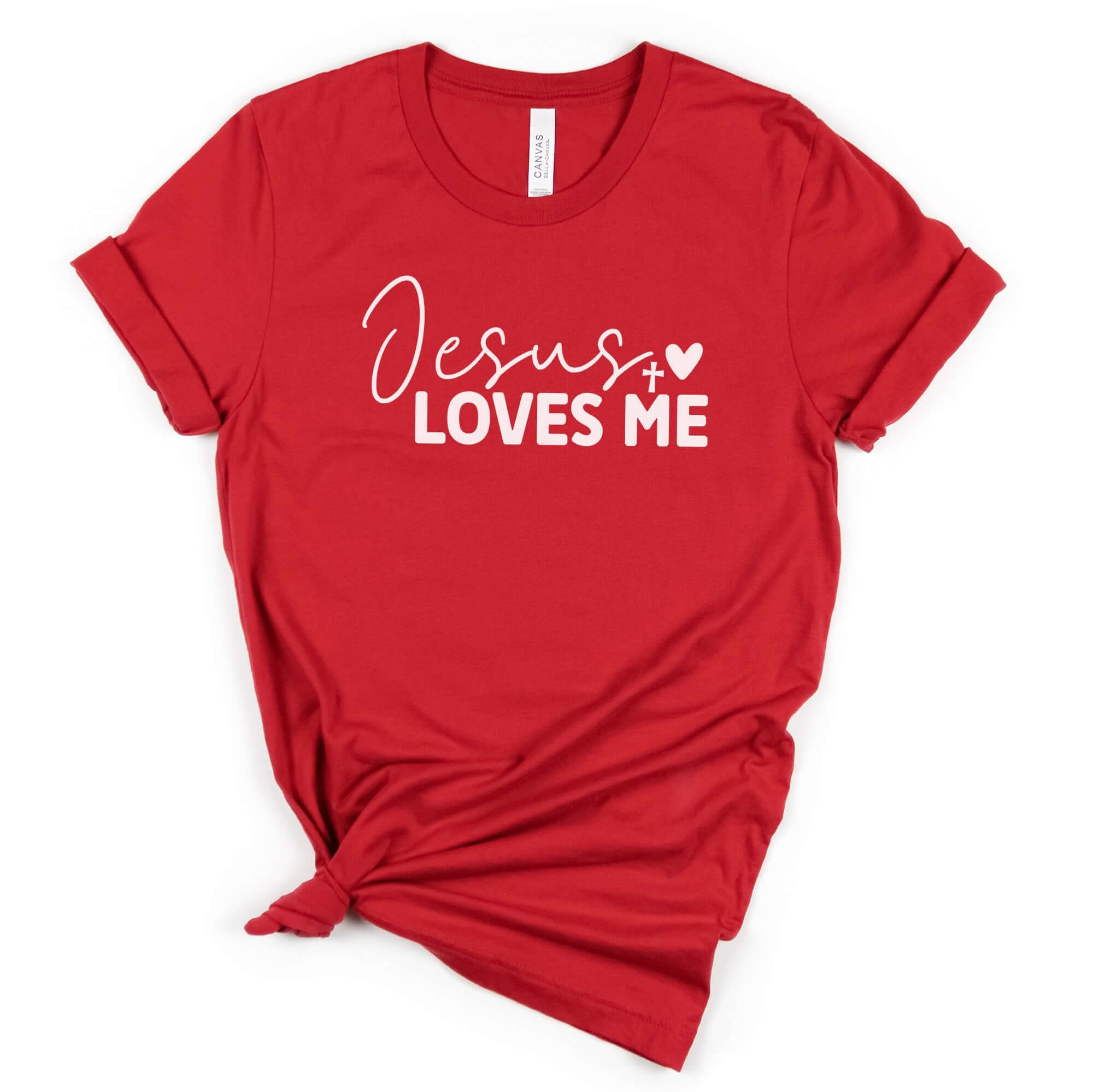 T-Shirts & TopsCelebrate your faith with this beautifully designed T-shirt featuring the inspiring message "Jesus Loves Me" in elegant script. Perfect for casual wear or group events, this shirt is a great way to spread a message of love and faith. Made f