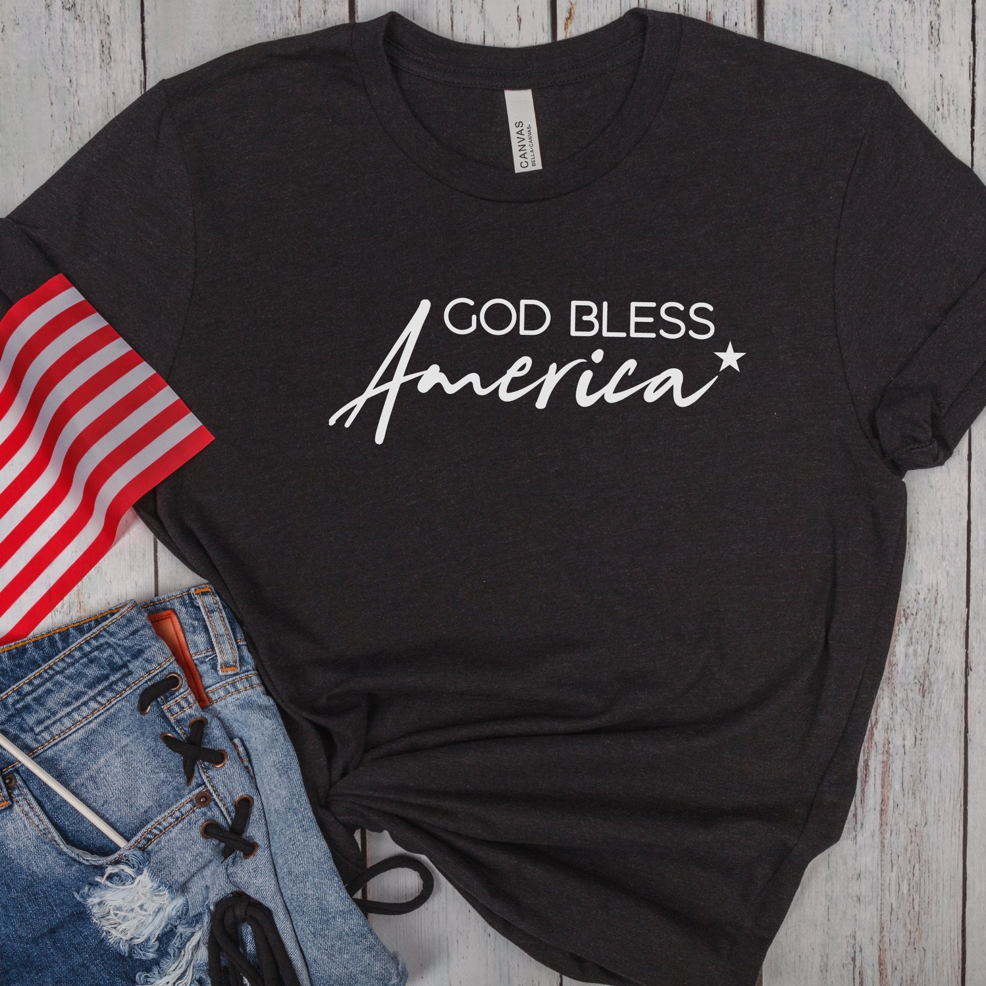 God Bless America Star Women's Short Sleeve T-shirt Size: XS Color: Solid Black Blend Jesus Passion Apparel