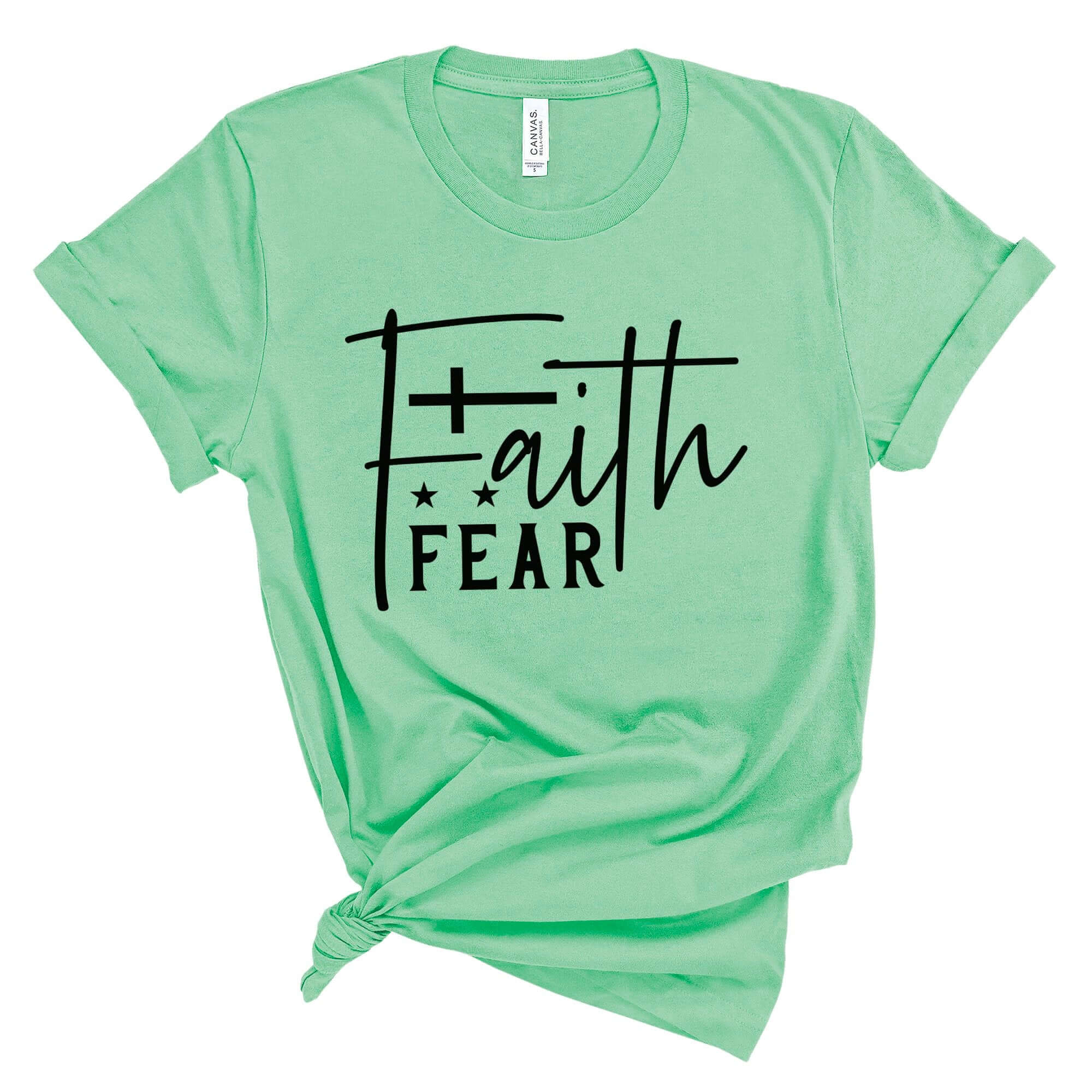 T-Shirts & TopsEnhance your wardrobe with this stylish and meaningful T-shirt featuring the powerful message "Faith Over Fear" in a chic handwritten script. Perfect for daily wear, it offers both comfort and inspiration. The minimalist design with a beaut