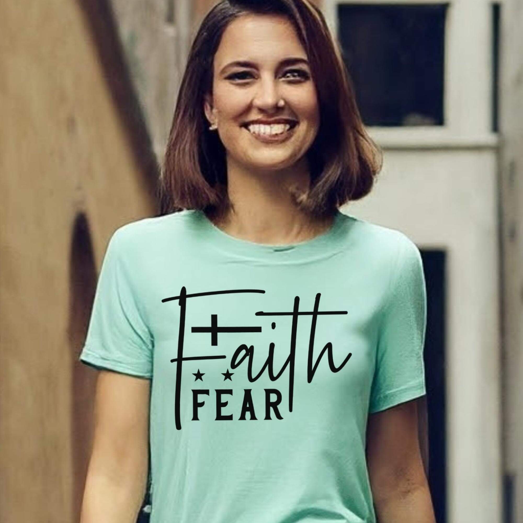 T-Shirts & TopsEnhance your wardrobe with this stylish and meaningful T-shirt featuring the powerful message "Faith Over Fear" in a chic handwritten script. Perfect for daily wear, it offers both comfort and inspiration. The minimalist design with a beaut