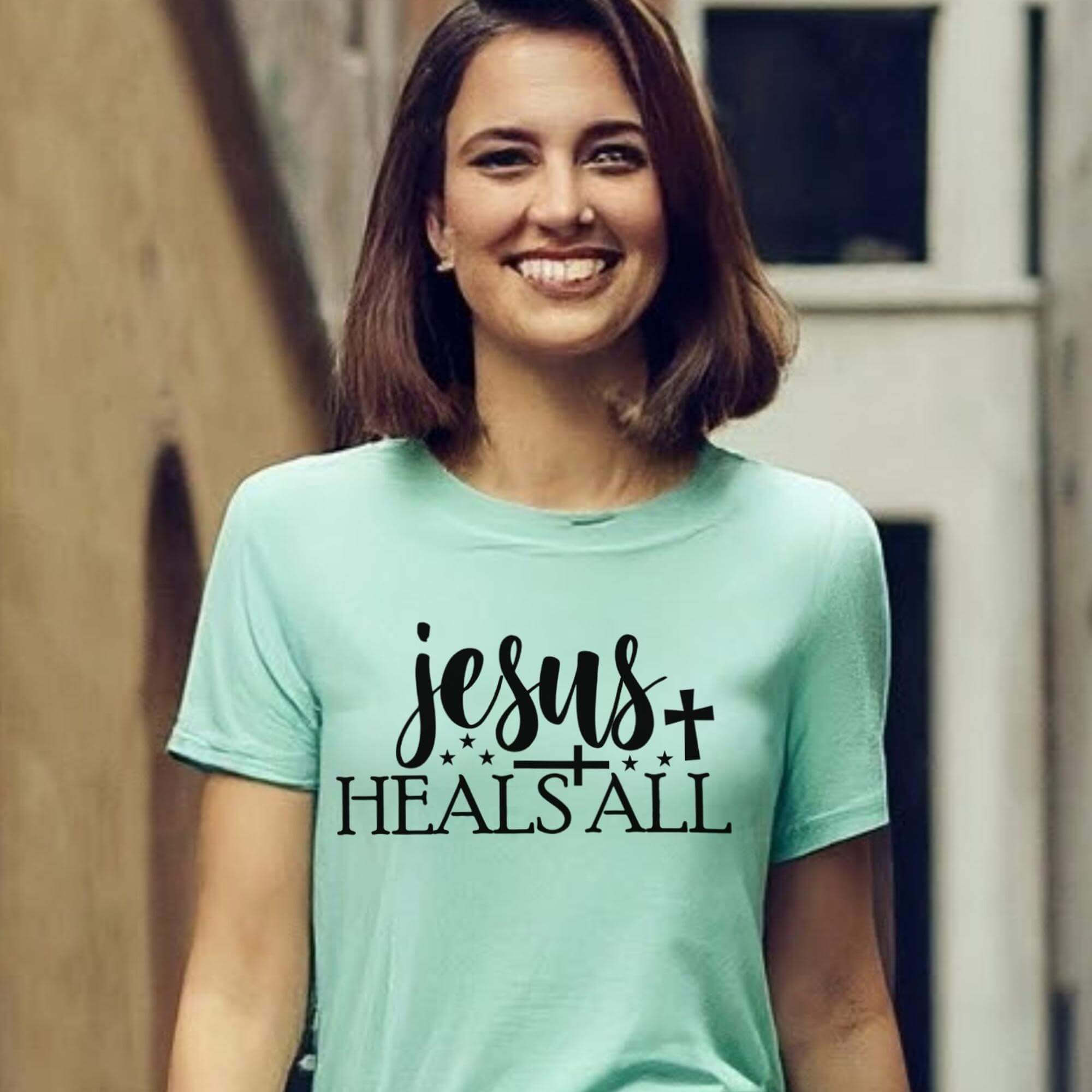 T-Shirts & TopsEmbrace your faith with this inspiring "Jesus Heals All" T-shirt. Featuring elegant calligraphy and symbolic stars and cross, this shirt is perfect for everyday wear or special church events. It's designed to offer comfort while expressing