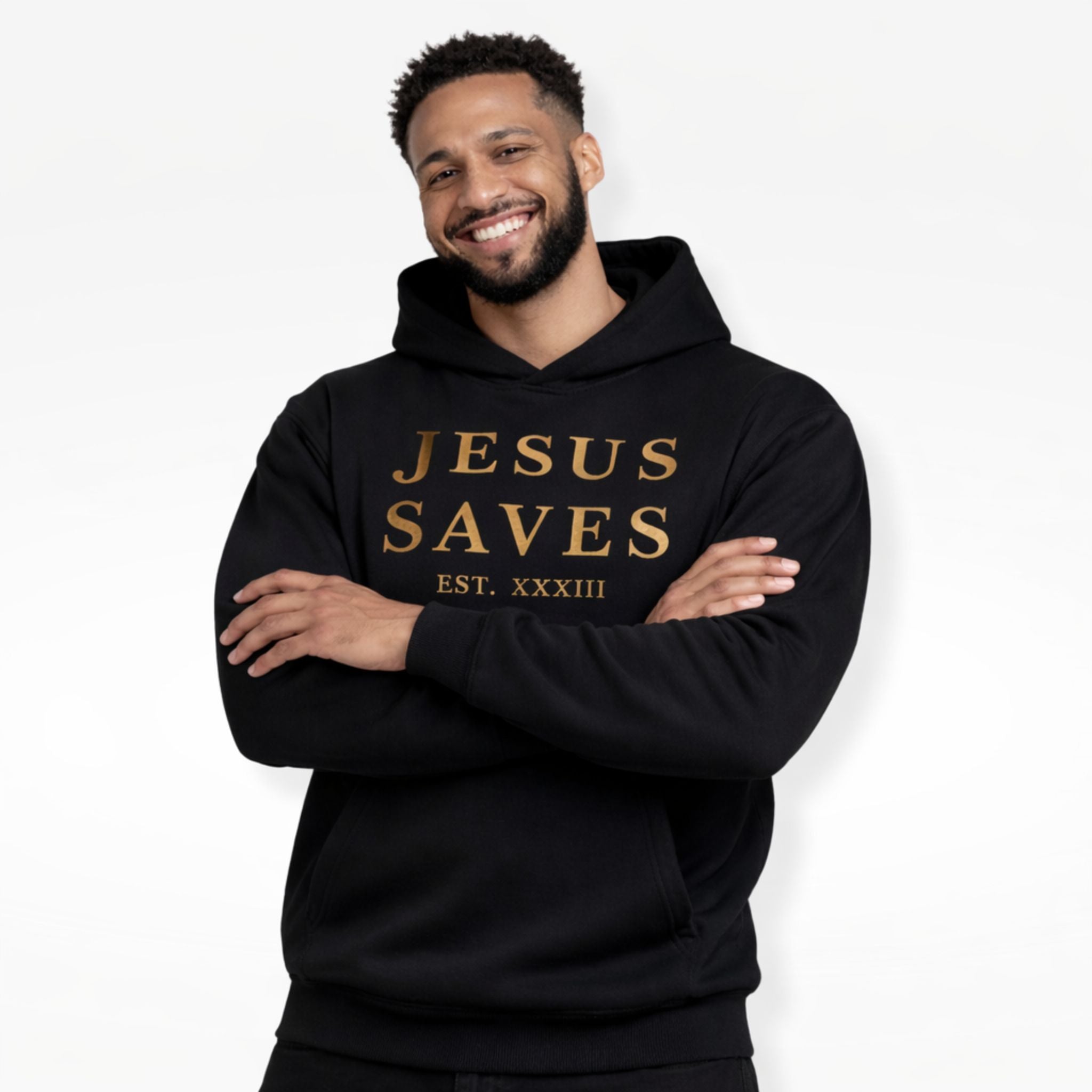 Man wearing a black hoodie with 'Jesus Saves' text on a white background