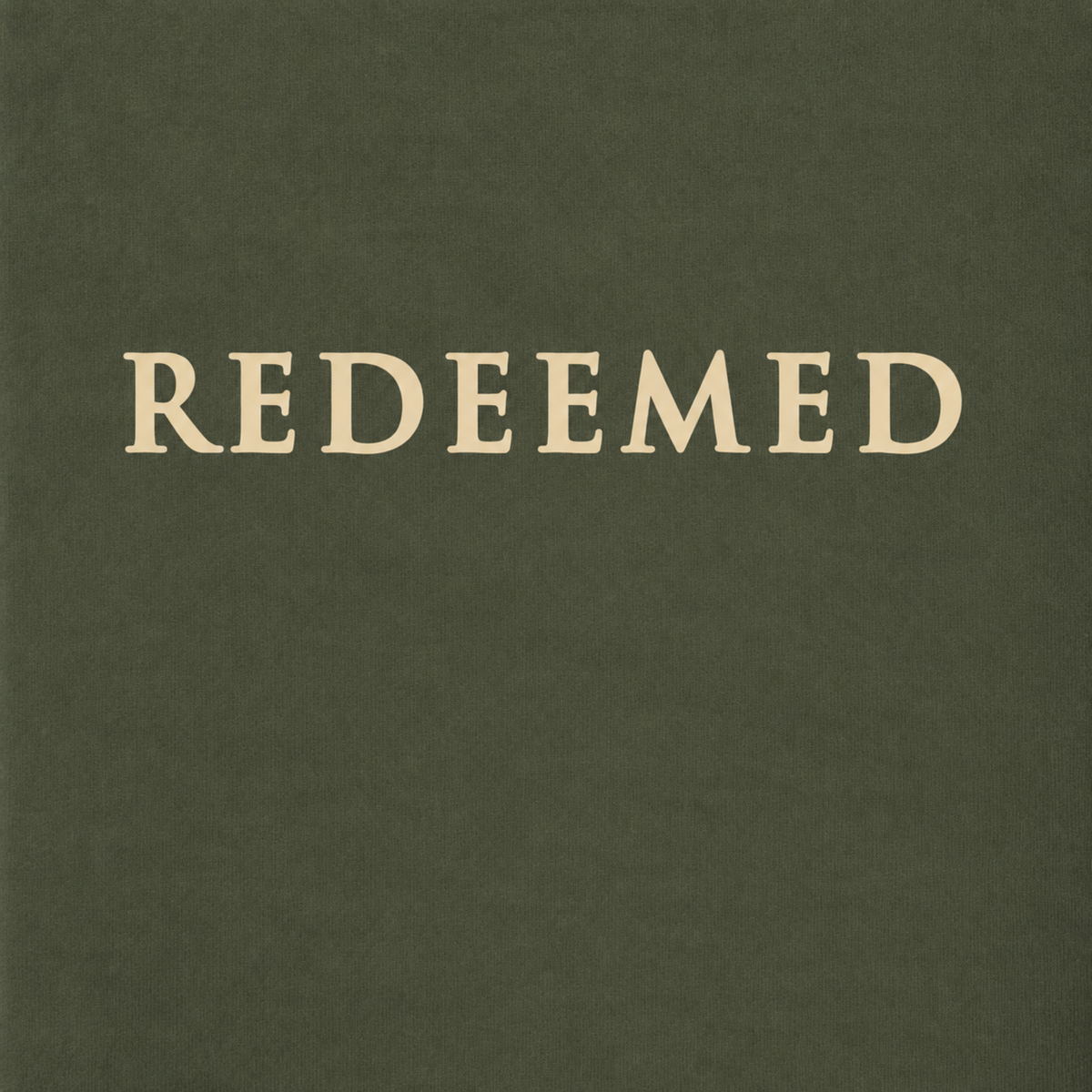 A square product shot featuring the word 'REDEEMED' in a light beige serif typeface, centered on a dark olive green textured background.