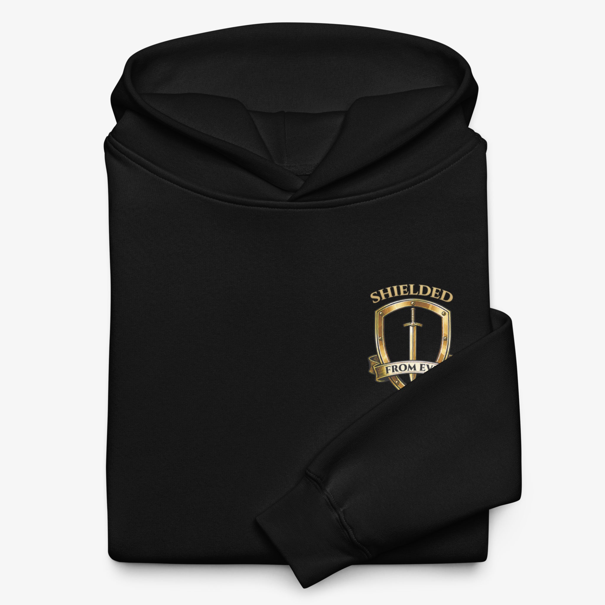 A folded black hoodie with a gold shield crest and the words 'SHELDED' and 'FROM EVOL' printed on the chest, shown on a light gray background.