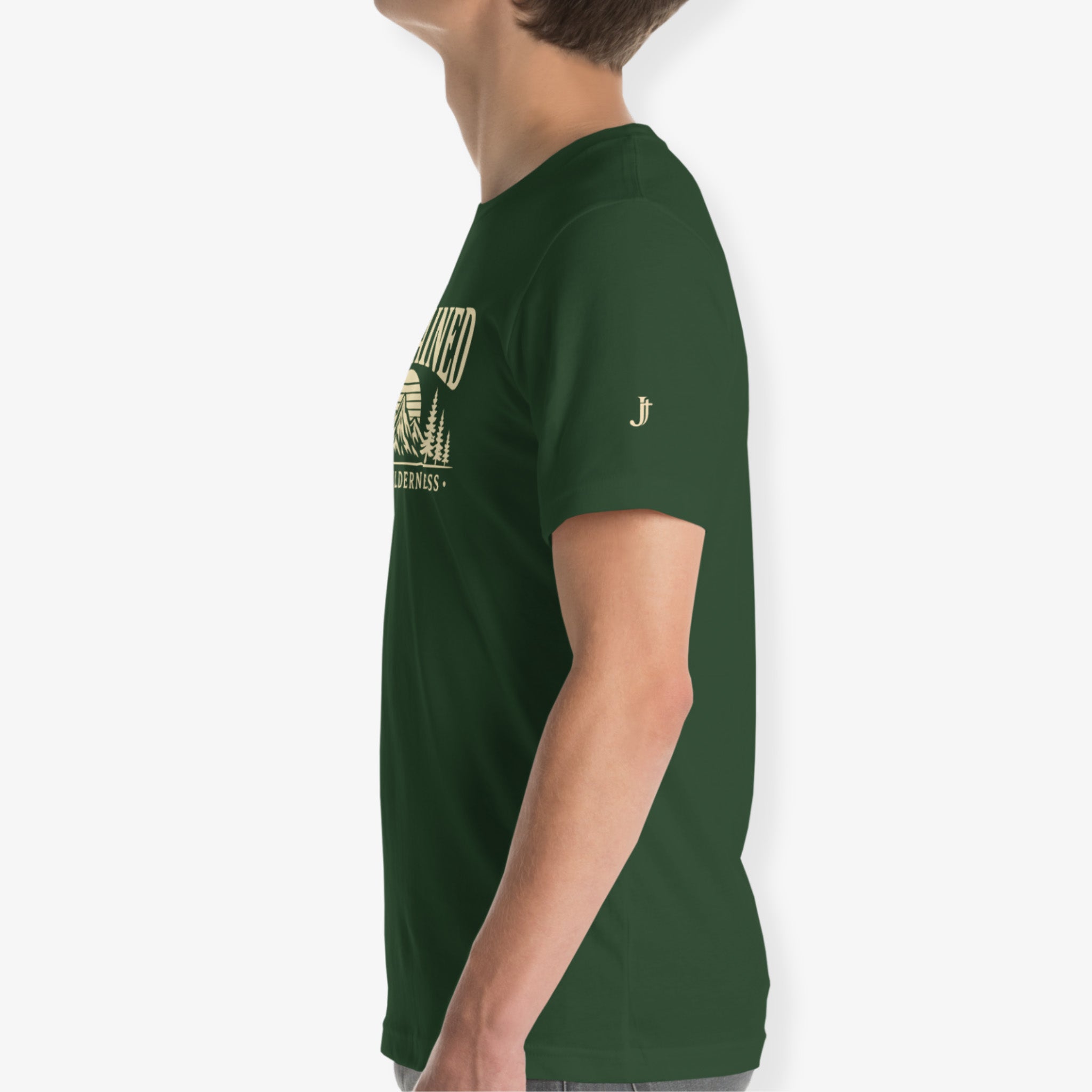 A side-profile view of a person wearing a dark green short-sleeve t-shirt with a gold graphic print on the chest and a small gold 'J' logo on the sleeve, set against a plain light gray background.