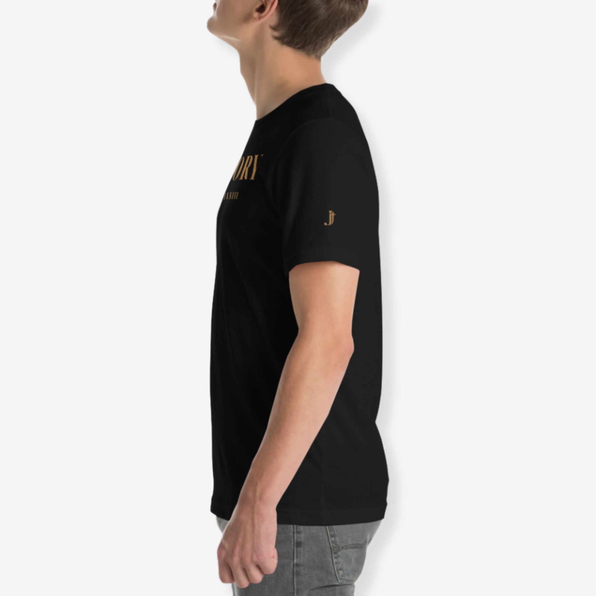 Person wearing a black t-shirt with gold text on a white background