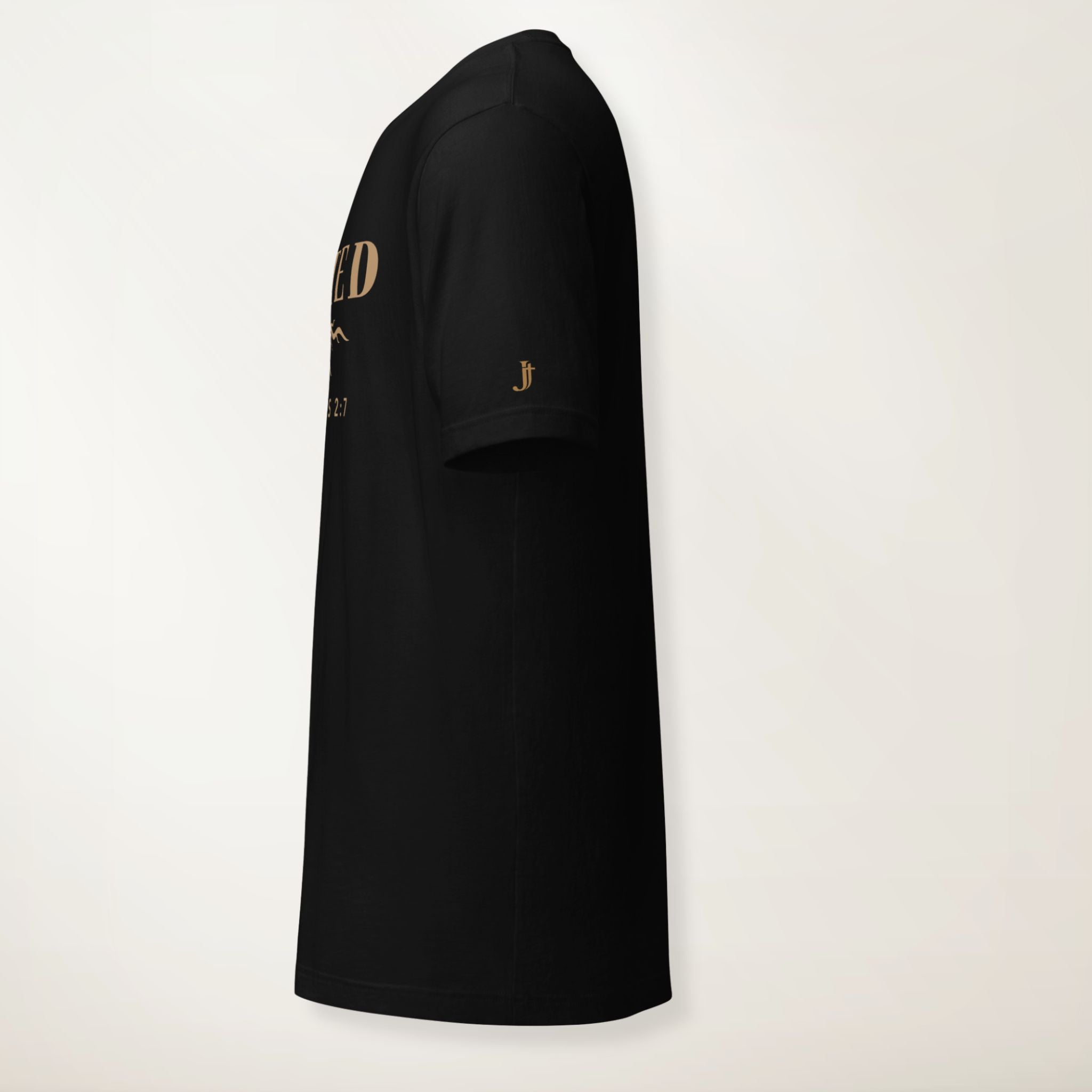 Black t-shirt with gold text and logo on a light gray background