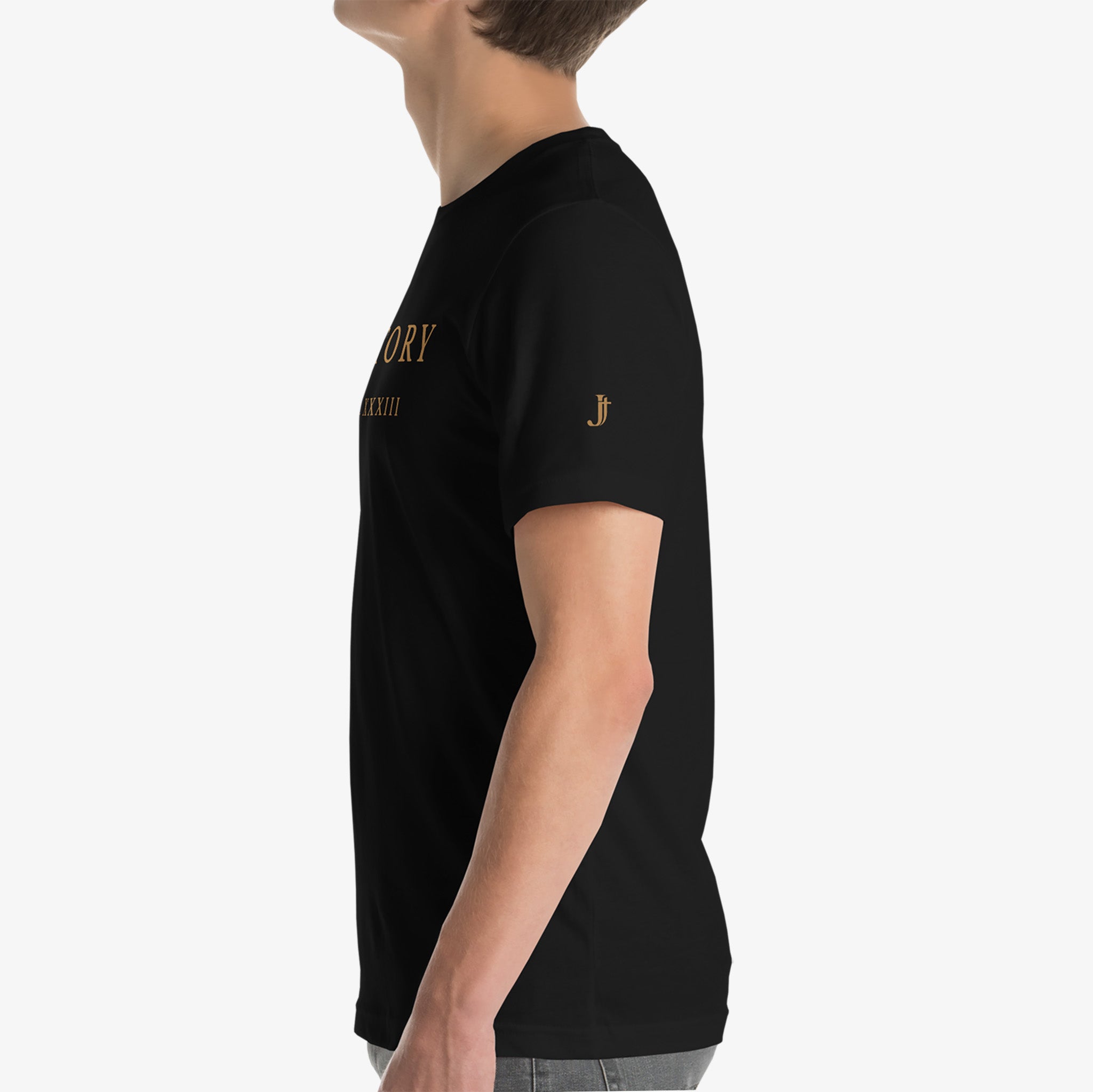 Person wearing a black t-shirt with gold text and logo on a white background