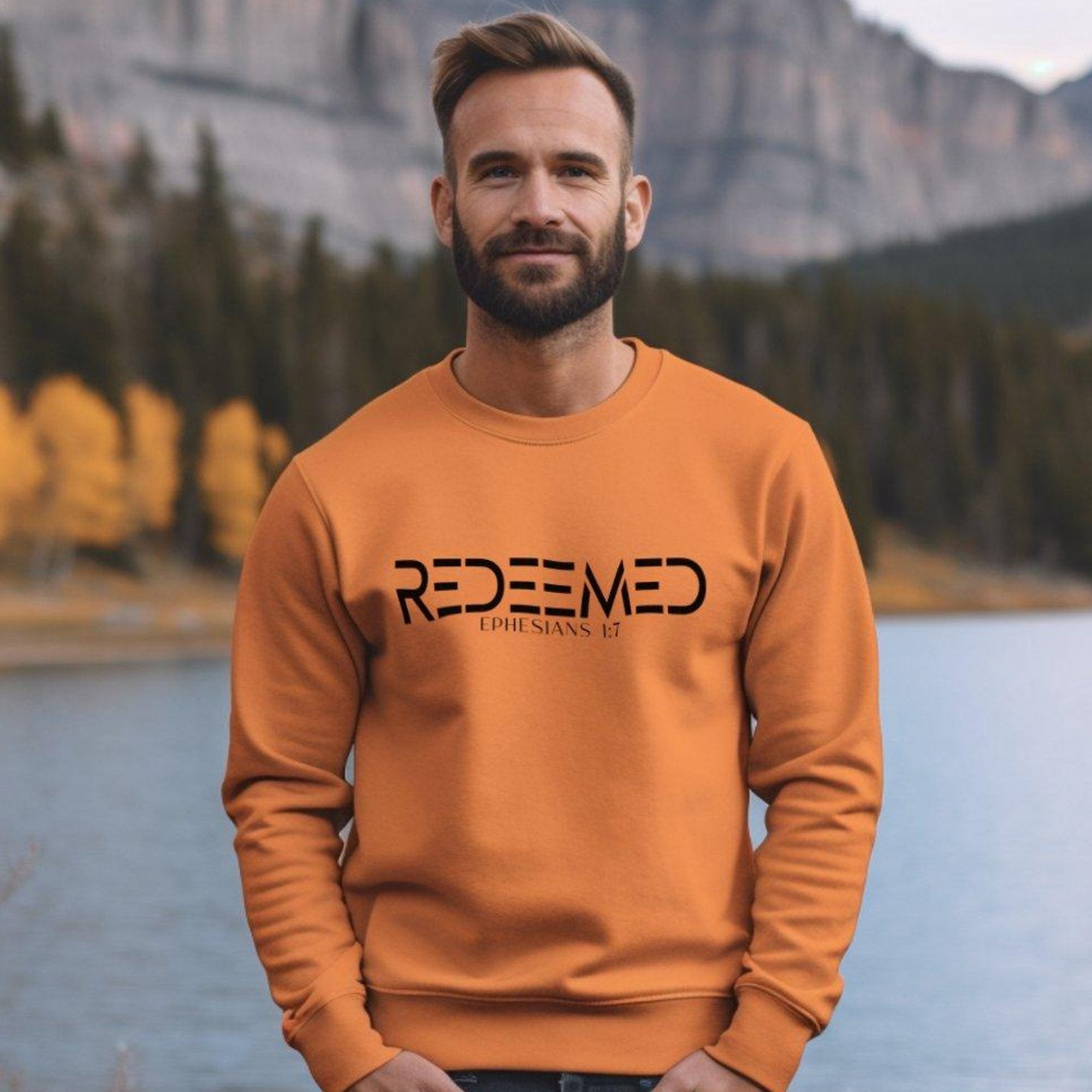 Redeemed Ephesians 1:7 Men's Fleece Unisex - Fit Sweatshirt - Orange - Jesus Passion Apparel