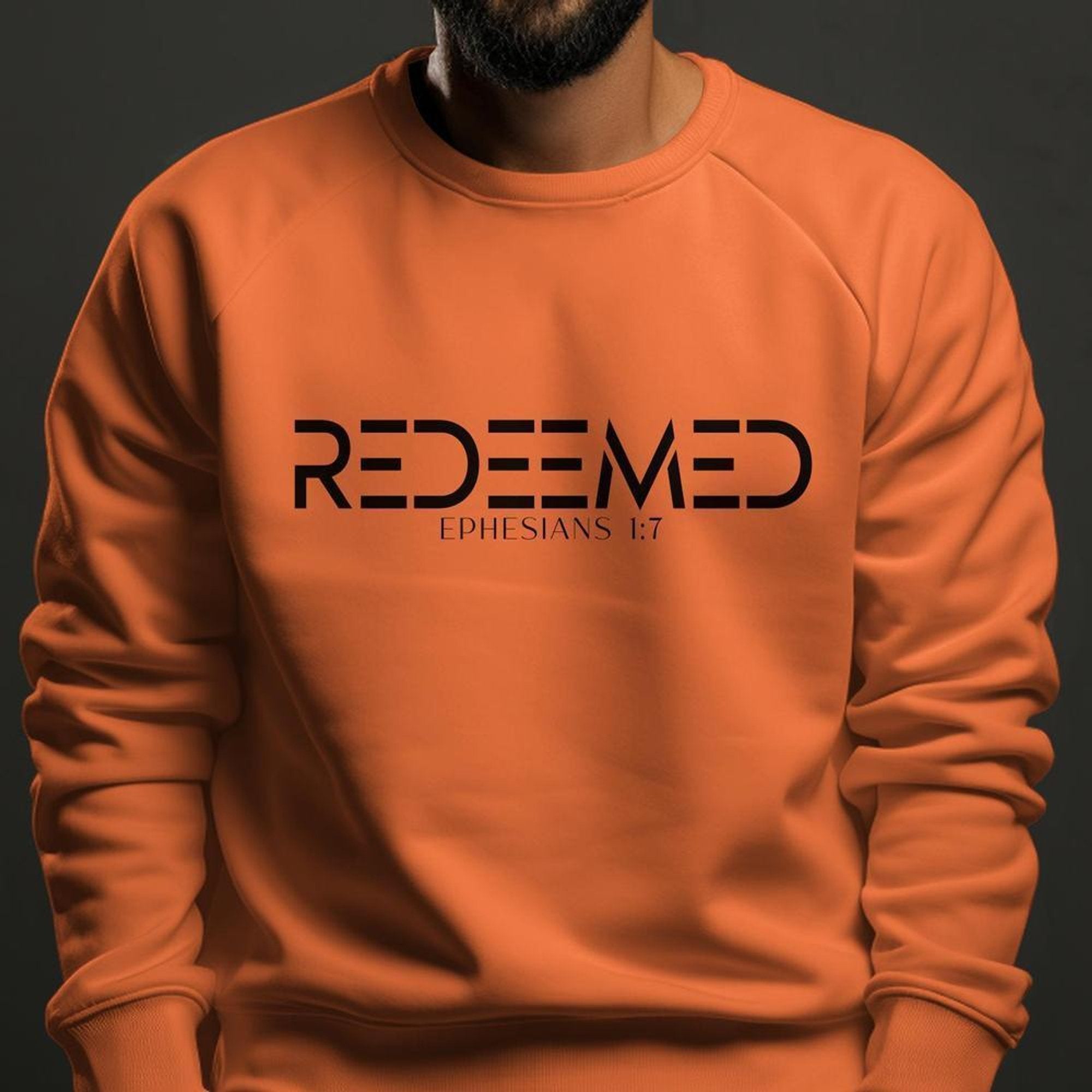 Redeemed Ephesians 1:7 Men's Fleece Unisex - Fit Sweatshirt - Orange - Jesus Passion Apparel