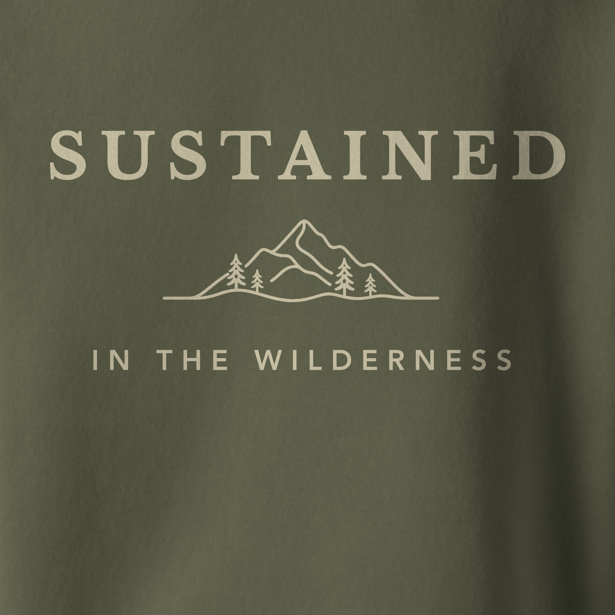 Dark green t-shirt with 'SUSTAINED IN THE WILDERNESS' text and mountain graphic.