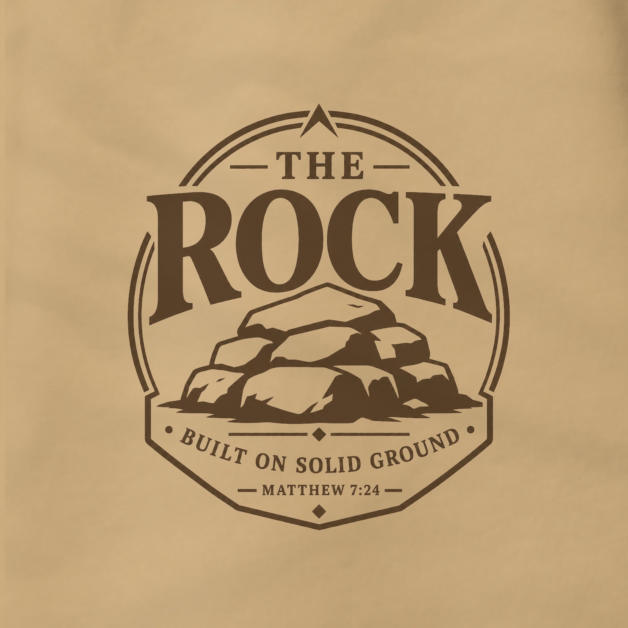 A circular vintage-style logo or emblem printed on a warm beige surface, featuring the words “THE ROCK” above a pile of rocks, with “BUILT ON SOLID GROUND” and “MATTHEW 7:24” below.