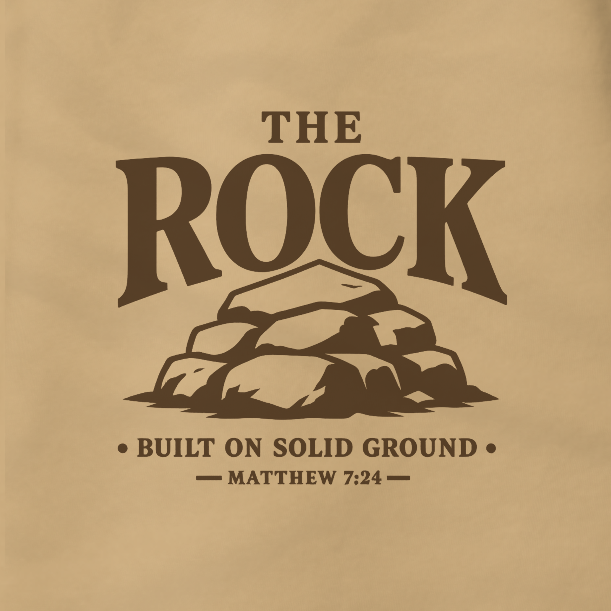 A square graphic print featuring the text 'THE ROCK BUILT ON SOLID GROUND — MATTHEW 7:24' in dark brown lettering on a warm tan background, with an illustration of stacked rocks in the center.